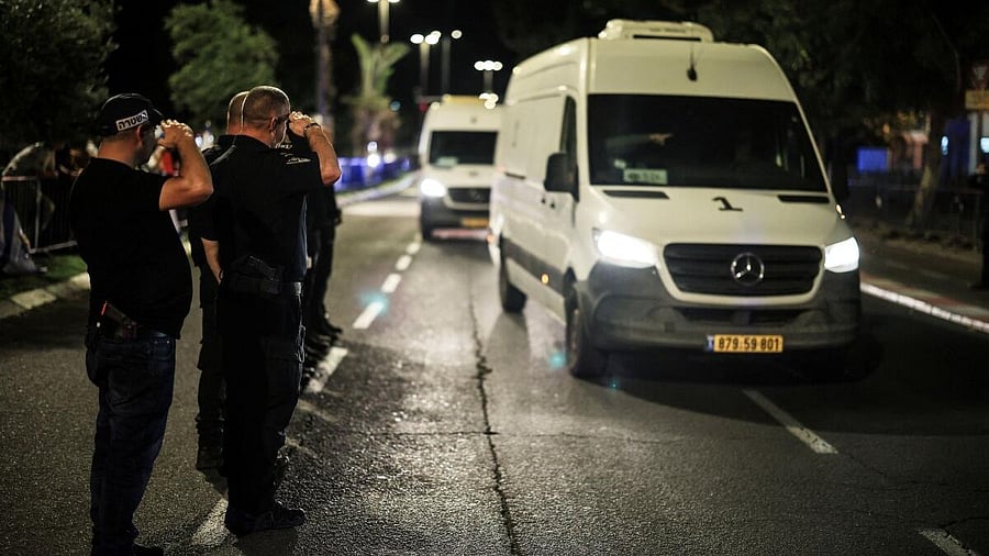 <div class="paragraphs"><p>Israeli policemen salute as vehicles carrying bodies of four deceased hostages, who had been held in Gaza since the deadly October 7, 2023 attack, arrive at forensic institute after being released amid a ceasefire between Israel and Hamas, in Tel Aviv, Israel October 13, 2025.</p></div>