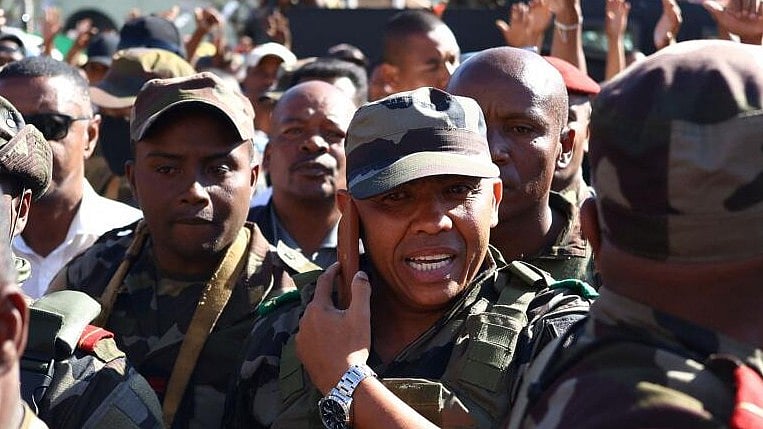 <div class="paragraphs"><p>Colonel Michael Randrianirina speaks on the phone.</p></div>