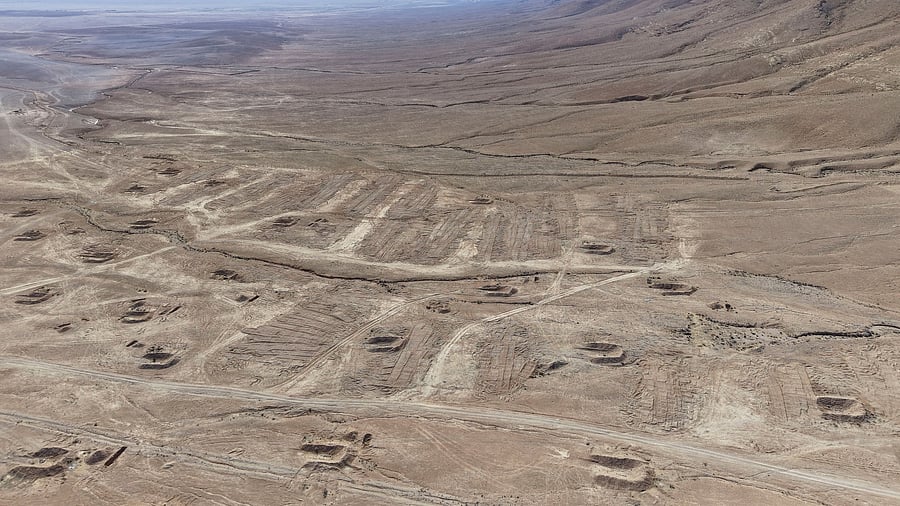 <div class="paragraphs"><p>A drone view of the mass grave site in the desert near the eastern Syrian town of Dhumair.</p></div>