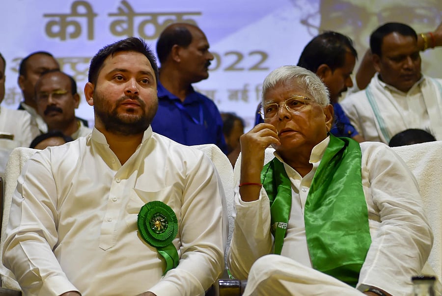 <div class="paragraphs"><p>RJD leader Tejashwi Yadav  with party supremo Lalu Yadav</p></div>