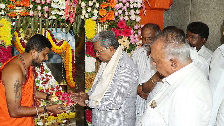 Chief Minister Siddaramaiah and Minister Ramalinga Reddy visit the Hasanamba temple on Wednesday.