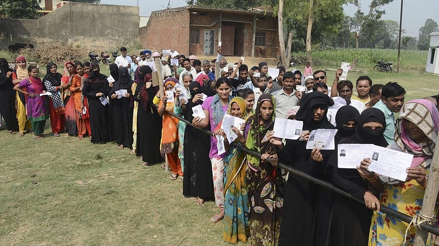 <div class="paragraphs"><p>File photo of burqa-clad women, along with other voters.&nbsp;</p></div>