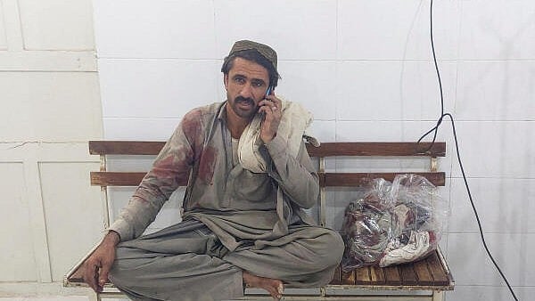 <div class="paragraphs"><p>A relative of a man who was injured following exchanges of fire between Pakistani and Afghan forces, sits in a hospital at the border crossing in Chaman, Balochistan province, Pakistan. Credit: Reuters</p></div>