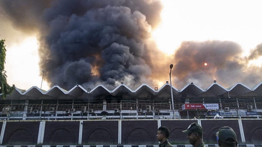 <div class="paragraphs"><p>Smoke billows as fire breaks out at the cargo complex of the Hazrat Shahjalal International Airport, in Dhaka, Bangladesh, Saturday, Oct. 18, 2025. The fire at the airport in Bangladesh's capital forced authorities to suspend all flight operations as thick black smoke engulfed the area.</p></div>