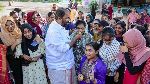 <div class="paragraphs"><p>Kerala Education Minister V Sivankutty with girl students. Image for representational purpose.</p></div>