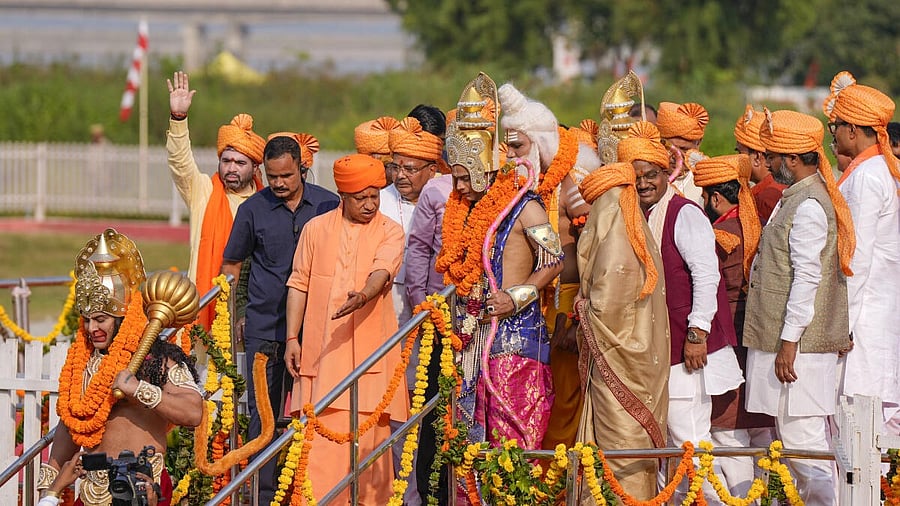 <div class="paragraphs"><p>Uttar Pradesh Chief Minister Yogi Adityanath with artists dressed as Lord Ram and Mata Sita during Deepotsav 2025 celebrations, in Ayodhya, Sunday, Oct. 19, 2025.</p></div>