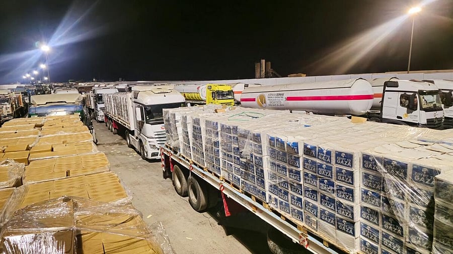 <div class="paragraphs"><p>Trucks carrying humanitarian aid and fuel line up at the crossing into the Gaza Strip at the Rafah border on the Egyptian side, amid a ceasefire between Israel and Hamas in Gaza, in Rafah, Egypt.</p></div>