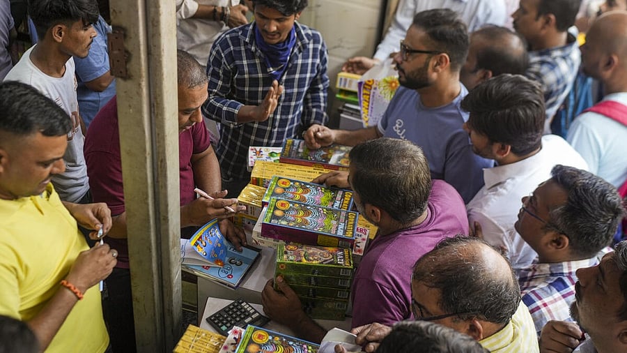 <div class="paragraphs"><p>People purchase firecrackers from a shop ahead of Diwali festival, days after the Supreme Court allowed the sale and bursting of green crackers in Delhi-NCR region, in New Delhi, Saturday, Oct. 18, 2025.</p></div>