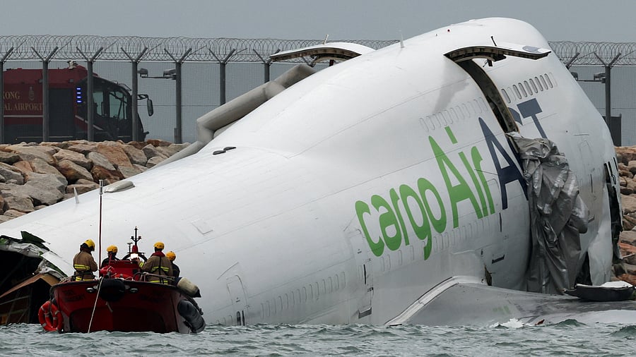<div class="paragraphs"><p>A cargo plane skids off the runway during landing at Hong Kong International Airport.</p></div>