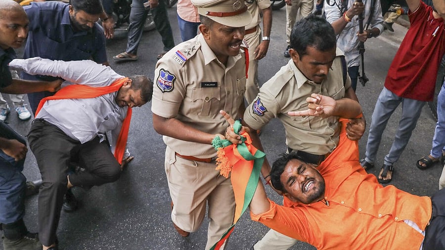 <div class="paragraphs"><p>Police personnel detain a BJP activist during a protest near the DGP office in Hyderabad on Thursday.</p></div>