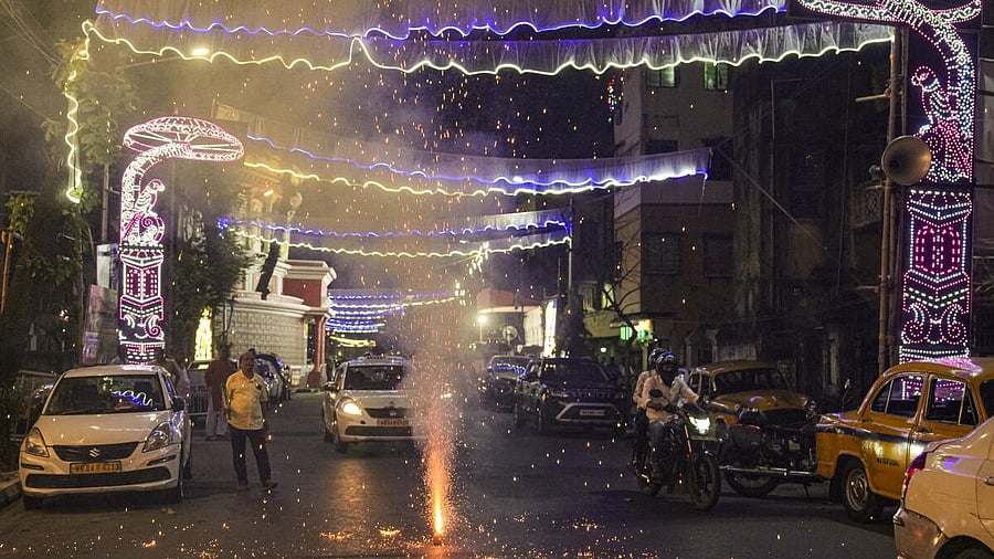 <div class="paragraphs"><p>People light firecrackers in Kolkata</p></div>