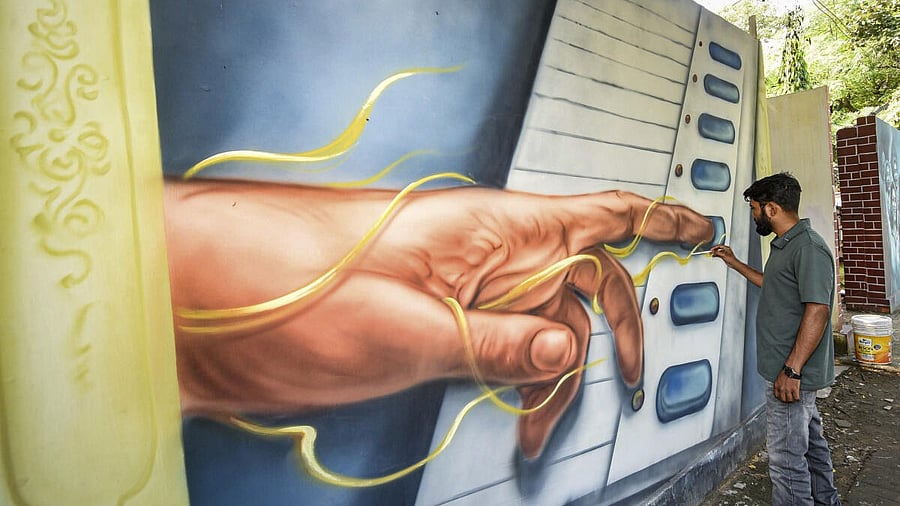<div class="paragraphs"><p>An artist paints a mural ahead of the Bihar Assembly elections, in Patna, Tuesday, Oct. 7, 2025</p></div>