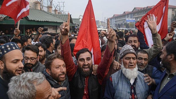 <div class="paragraphs"><p>Workers and supporters of Jammu and Kashmir National Conference (JKNC) celebrate outside the counting center after the party won three Rajya Sabha seats in the state, in Srinagar</p></div>