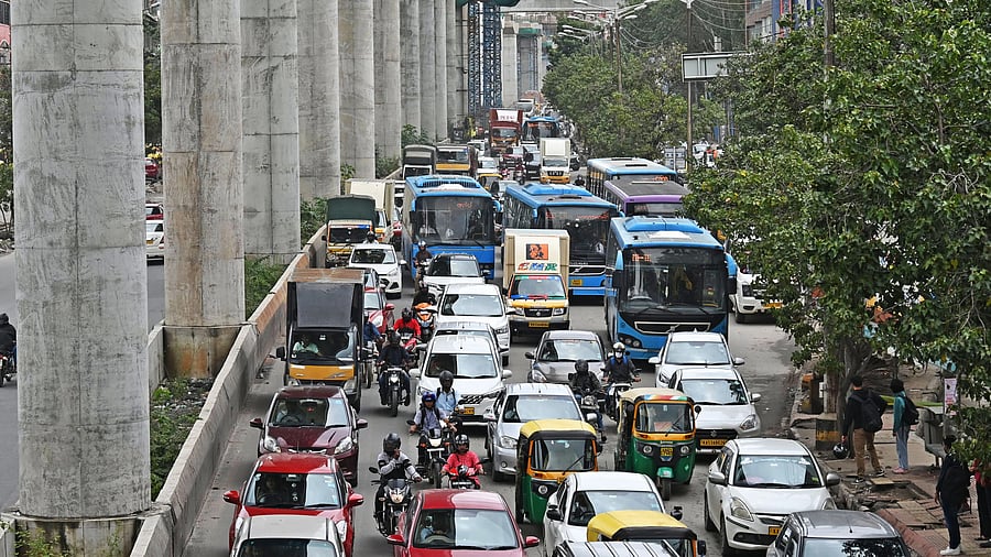 <div class="paragraphs"><p>A long line of vehicles inch forward on a stretch of the Outer Ring Road. </p></div>