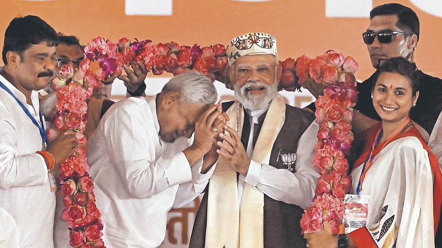 <div class="paragraphs"><p>Prime Minister Narendra Modi and Bihar Chief Minister Nitish Kumar being garlanded during a public meeting ahead of the state Assembly elections, in Samastipur district, Friday, Oct. 24, 2025.</p></div>