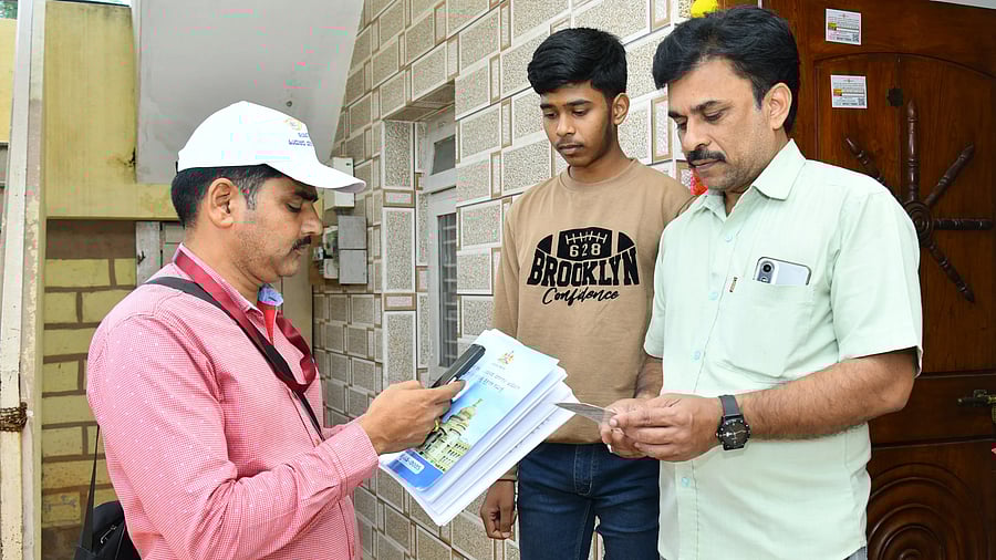 <div class="paragraphs"><p>An enumerator collects data for the Karnataka Social and Educational Survey from a family in Haveri. </p></div>