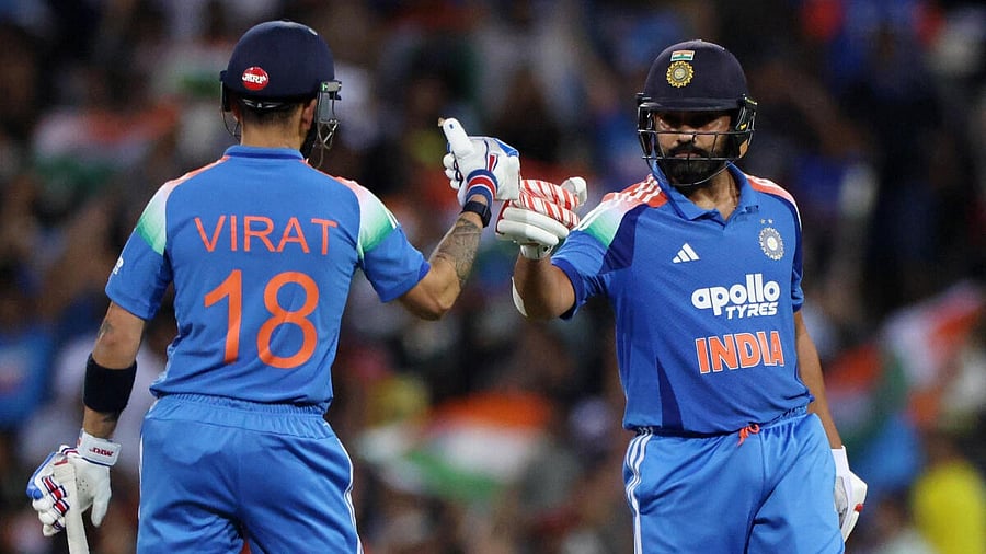 <div class="paragraphs"><p>Rohit Sharma celebrates withVirat Kohli after hitting six runs off the bowling of Australia's Adam Zampa.</p></div>