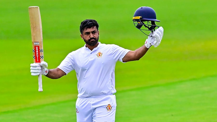 <div class="paragraphs"><p>Karnataka batter Karun Nair celebrates after scoring a century against Goa on the second day of their Ranji Trophy match in Shivamogga on Sunday. </p></div>