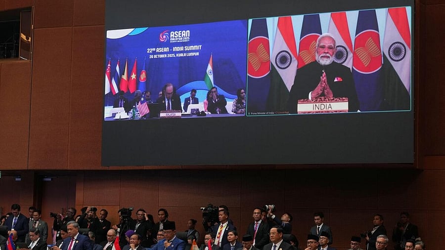 <div class="paragraphs"><p>Indian Prime Minister Narendra Modi is seen on a screen at the top right delivering a virtual speech to ASEAN leaders during the 47th Association of Southeast Asian Nations (ASEAN) Summit in Kuala Lumpur, Malaysia.</p></div>