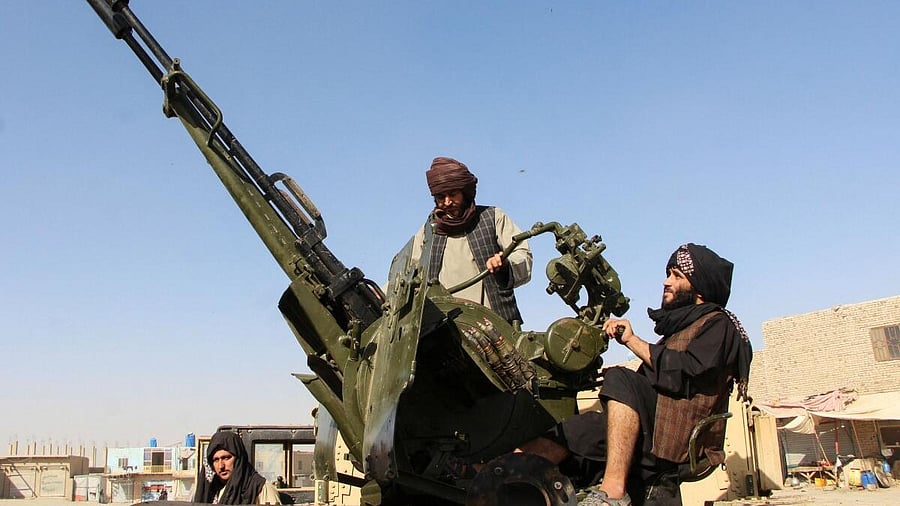 <div class="paragraphs"><p>An Afghan Taliban fighter sit next to an anti-aircraft gun near the Afghanistan-Pakistan border. (Representative image)</p></div>