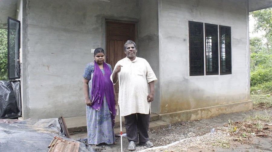<div class="paragraphs"><p>Shy and Sunitha at their newly built home at Kumaramangalam in Idukki district</p></div>