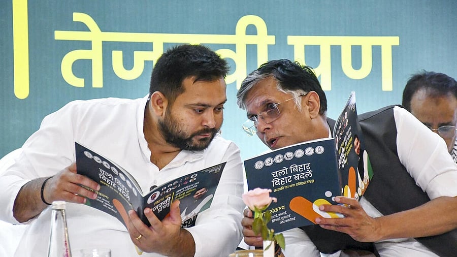<div class="paragraphs"><p>Leader of Opposition in Bihar Assembly and RJD leader Tejashwi Yadav and Congress leader Pawan Khera during the manifesto.  </p></div>