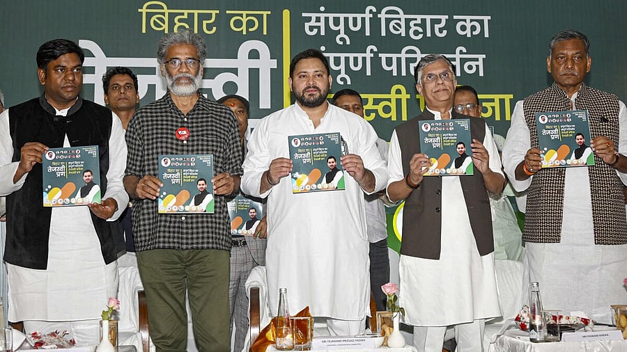 <div class="paragraphs"><p>RJD leader Tejashwi Yadav along with Congress leaders Pawan Khera and Akhilesh Prasad Singh, CPI (ML) Liberation General Secretary Dipankar Bhattacharya and Vikassheel Insaan Party chief Mukesh Sahni releases INDIA bloc's manifesto for Bihar Assembly elections, in Patna, Tuesday, Oct. 28, 2025.</p></div>