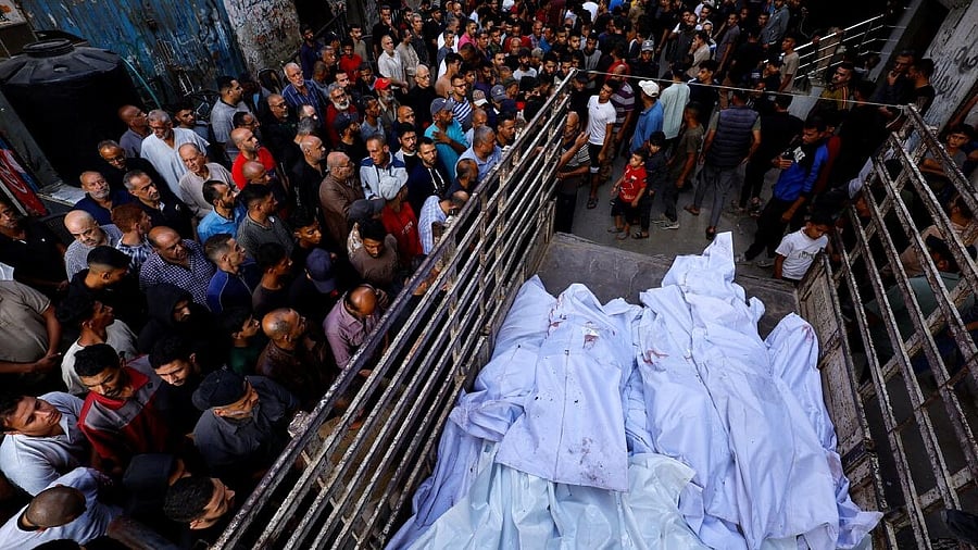 <div class="paragraphs"><p>Mourners gather around the bodies of members of the Abu Dalal family, who were killed in an overnight Israeli strike on their home, according to medics, in Nuseirat, central Gaza Strip, October 29, 2025.</p></div>
