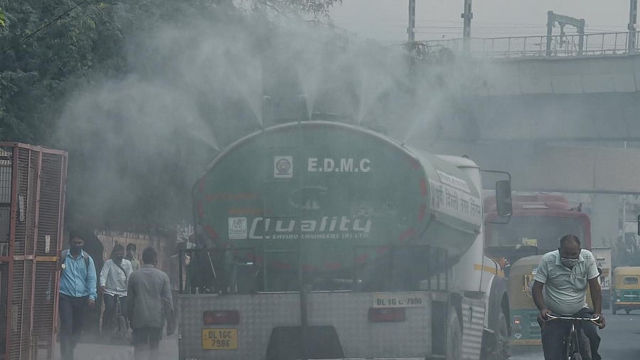 <div class="paragraphs"><p>Municipal workers use a modified water tanker to sanitise near Anand Vihar area, in East Delhi</p></div>