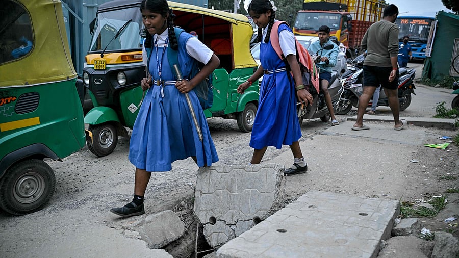 <div class="paragraphs"><p>Students are forced to walk on a damaged pavement amid poor footpath conditions.</p></div>