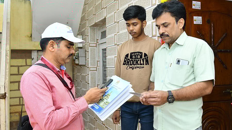 <div class="paragraphs"><p>An enumerator collects data for the Karnataka Social and Educational Survey from a family in Haveri. </p></div>