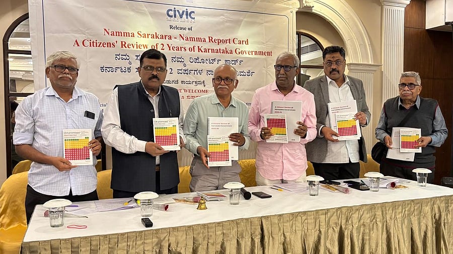 Dignitaries release a report card titled 'Our Government, Our Report Card' brought out by CIVIC-Bangalore on Friday.