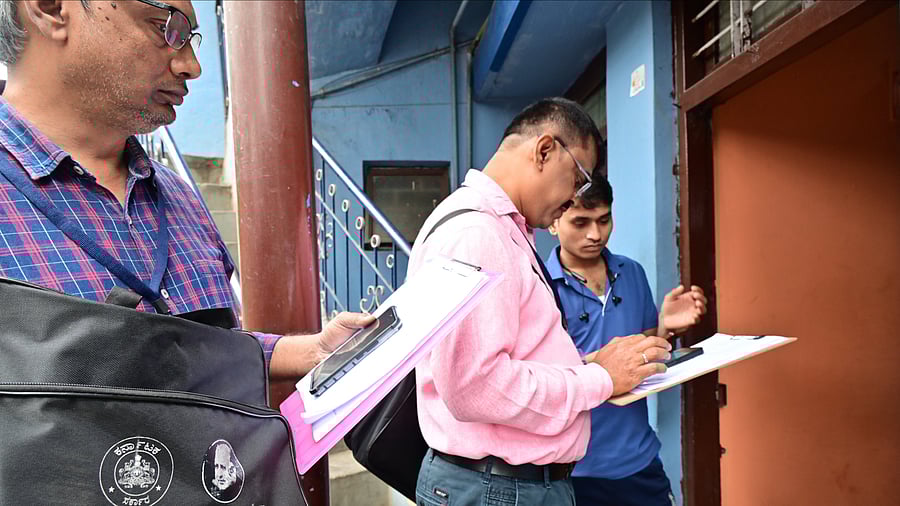 <div class="paragraphs"><p>An enumerator fills in the details at a household during the socio-educational survey at&nbsp;Ganganagar in Bengaluru.</p></div>