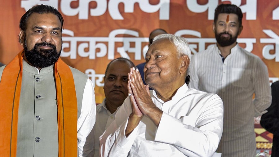 <div class="paragraphs"><p>Bihar Chief Minister Nitish Kumar with Deputy CM Samrat Choudhary and JDU National Working President Sanjay Jha during release of the National Democratic Alliance's (NDA) manifesto for the upcoming state Assembly elections, in Patna, Friday, Oct. 31, 2025.</p></div>