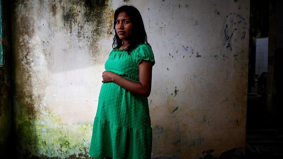 <div class="paragraphs"><p>Edireide Munduruku, a pregnant woman, poses for a picture during a mission by researchers from the Brazilian public health institute Fiocruz to investigate health disorders among Munduruku Indigenous people that are potentially linked to mercury contamination caused by illegal gold mining, in Sai Cinza village, in the municipality of Jacareacanga, Para state, Brazil.</p></div>