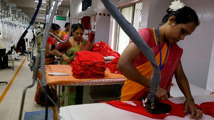 <div class="paragraphs"><p>Workers iron garments in Bengaluru.</p></div>