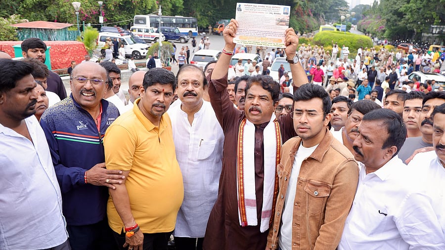<div class="paragraphs"><p>Leader of the Opposition in the Karnataka Legislative Assembly, R Ashoka, with Bangalore South MP LS Tejasvi Surya, MLAs Uday Garudachar and CK Ramamurthy and others during a protest against the Bengaluru tunnel road project at Lalbagh on Sunday.</p></div>