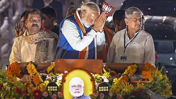 <div class="paragraphs"><p>Prime Minister Narendra Modi, center, Union Minister Rajiv Ranjan alias Lalan Singh, right, and Bihar BJP President Dilip Kumar Jaiswal during an election roadshow for the Bihar Assembly polls, in Patna.</p></div>