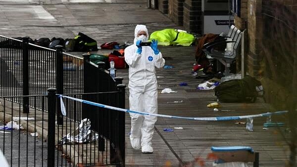 <div class="paragraphs"><p>A forensic officer works at the scene at Huntingdon Station following a series of stabbings on a train, near Cambridge, Britain.</p></div>