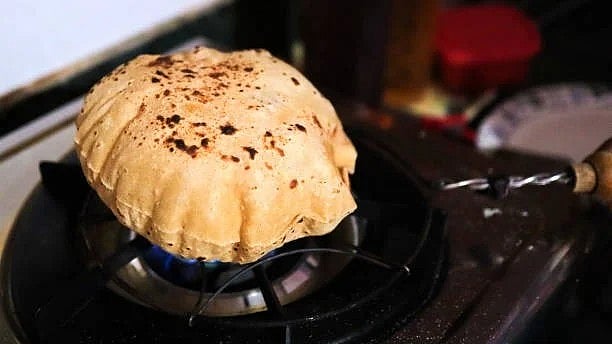 <div class="paragraphs"><p>Representative image of cooking a roti.</p></div>