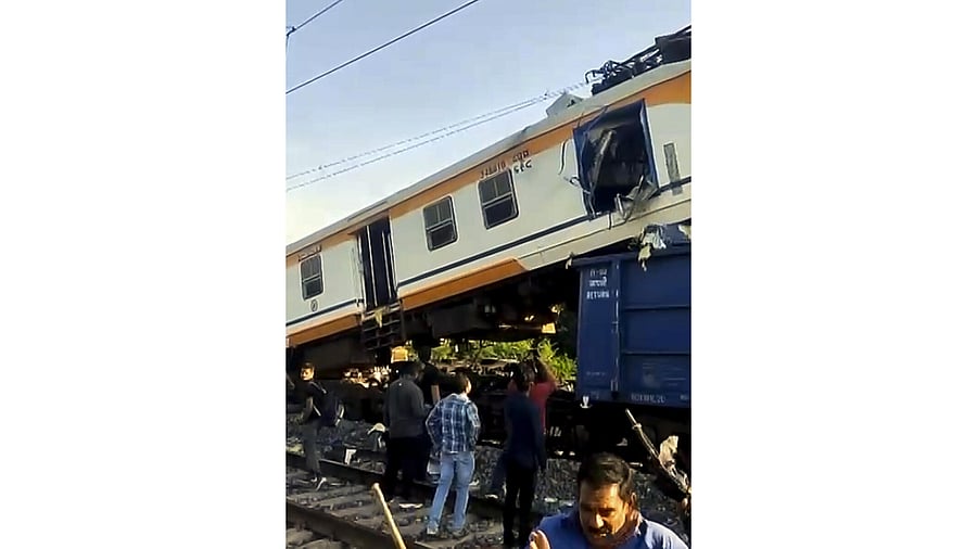 <div class="paragraphs"><p>People gather after a passenger train collided with a goods train near Bilaspur railway station, Chhattisgarh.</p></div>