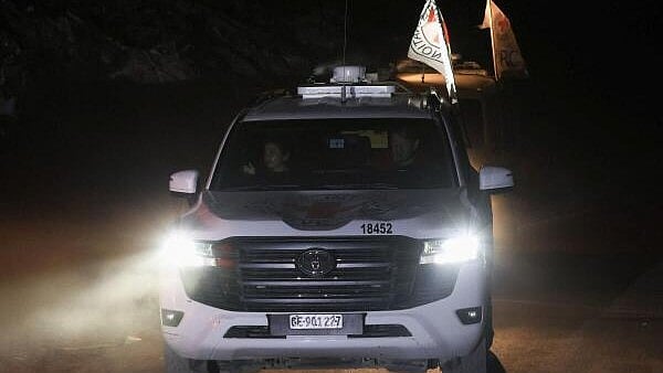 <div class="paragraphs"><p>A Red Cross vehicle transports a body, after Hamas said that it found the body of an Israeli hostage.</p></div>