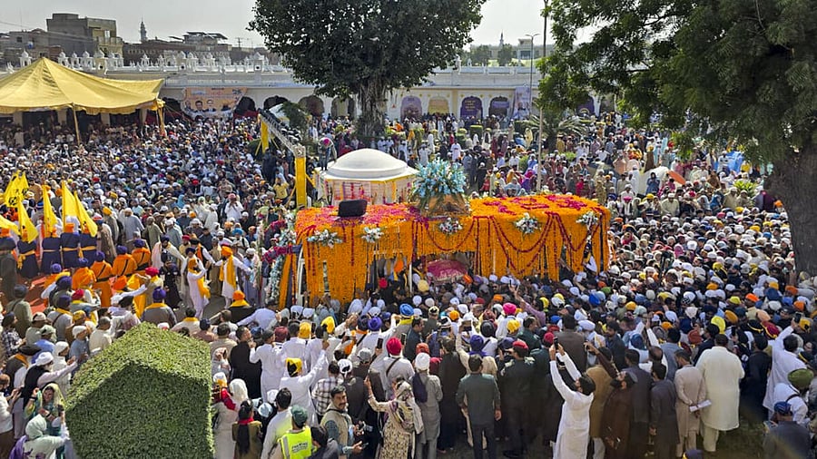 <div class="paragraphs"><p>People attend the 'Nagar Kirtan' organized by the Pakistan Sikh Gurdwara Parbandhak Committee from Gurdwara Nankana Sahib, the birthplace of Guru Nanak Dev, on his birth anniversary, in Lahore, Pakistan. (Image for representational purpose)</p></div>