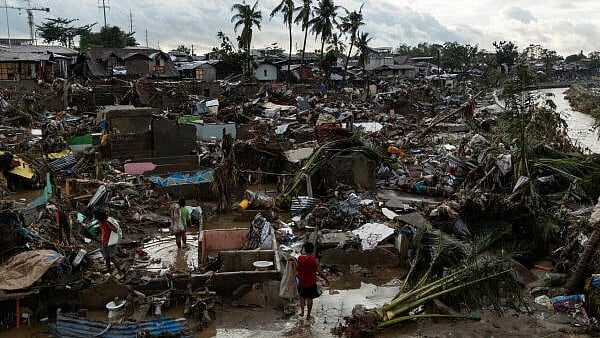<div class="paragraphs"><p>Residents return to the remains of their wrecked homes after heavy flooding caused by Typhoon Kalmaegi.</p></div>