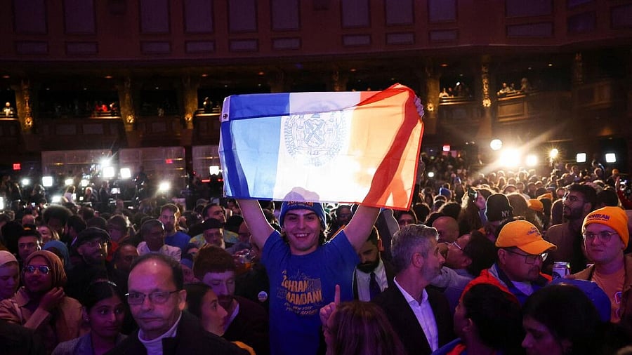 <div class="paragraphs"><p>A supporter holds a New York City flag as initial projections of Democratic candidate for New York City mayor Zohran Mamdani's win are declared during an election night watch party in the Brooklyn borough of New York City, New York, U.S., November 4, 2025.</p></div>