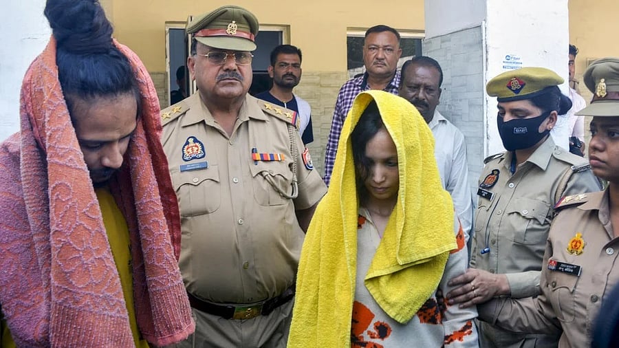 <div class="paragraphs"><p>Police take away Muskan and her lover Sahil Shukla after they were arrested in connection with Meerut murder case.</p></div>