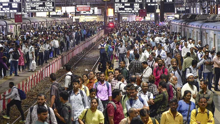 <div class="paragraphs"><p>Passengers gather and wait on platforms as railway unions halted local trains during peak hours to protest the FIR filed against engineers in connection with an accident case, at Chhatrapati Shivaji Maharaj Terminus (CSMT), in Mumbai,</p></div>