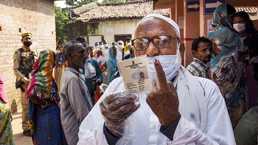 <div class="paragraphs"><p>A voter shows his finger marked with indelible ink at a polling station after casting his vote for the first phase Bihar Assembly Elections, at Paliganj in Patna. </p></div>