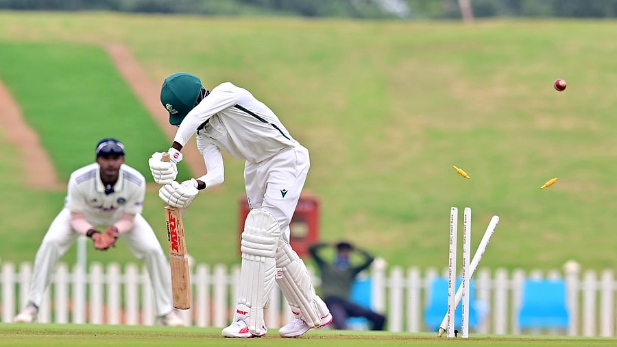 South Africa A's Lesego Senokwane is cleaned up by India A pacer Akash Deep (not seen in the photo) on the second day of their four-day match at the BCCI's CoE in Bengaluru on Friday. DH Photo/ Prashanth HG