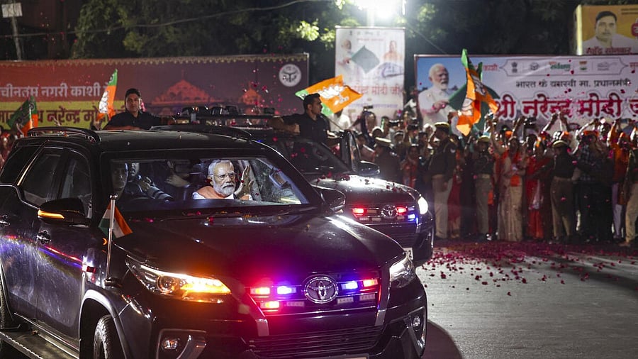 <div class="paragraphs"><p>Prime Minister Narendra Modi during a roadshow, people showered flower petals on his cavalcade amidst chanting of ‘Har Har Mahadev’, in Varanasi.</p></div>